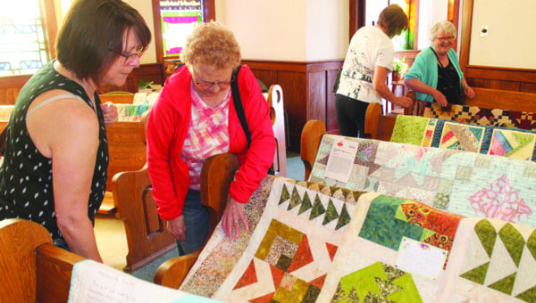 Young and old enjoy new and old quilts at Plenty show
