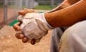 Baseball player sittnig on the bench Baseball all-star shift puts spotlight on Colorado’s exceptional voting laws